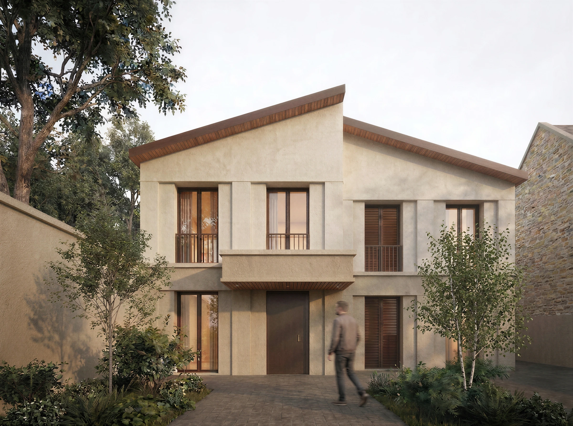 Façade sur rue de la maison individuelle, volumes en pierre et enduit clair sous toiture à pente inversée, Sucy-en-Brie